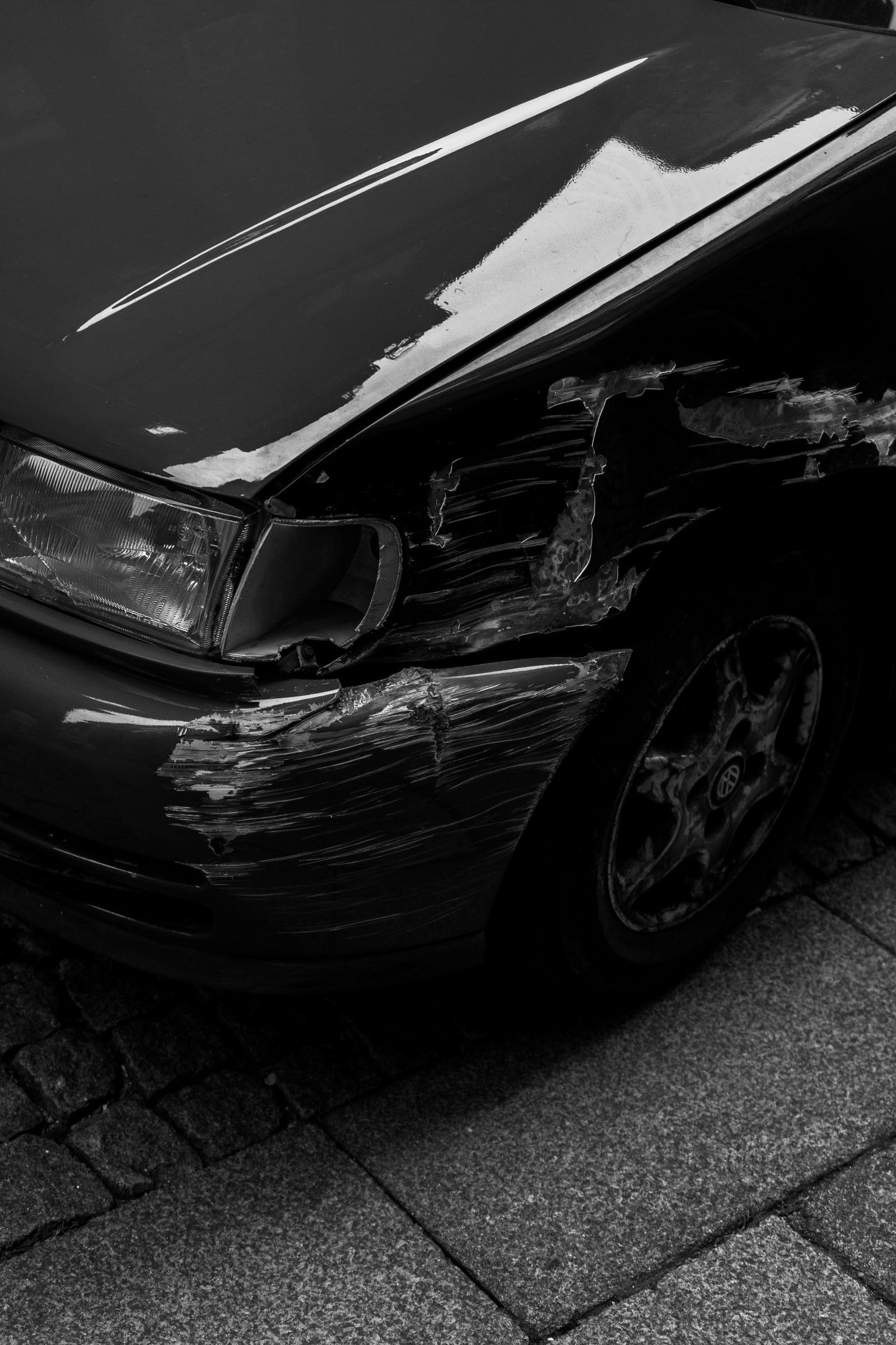 Damage to the front of a car, the kind of crash a personal injury attorney handles in Cottonwood Heights, Utah